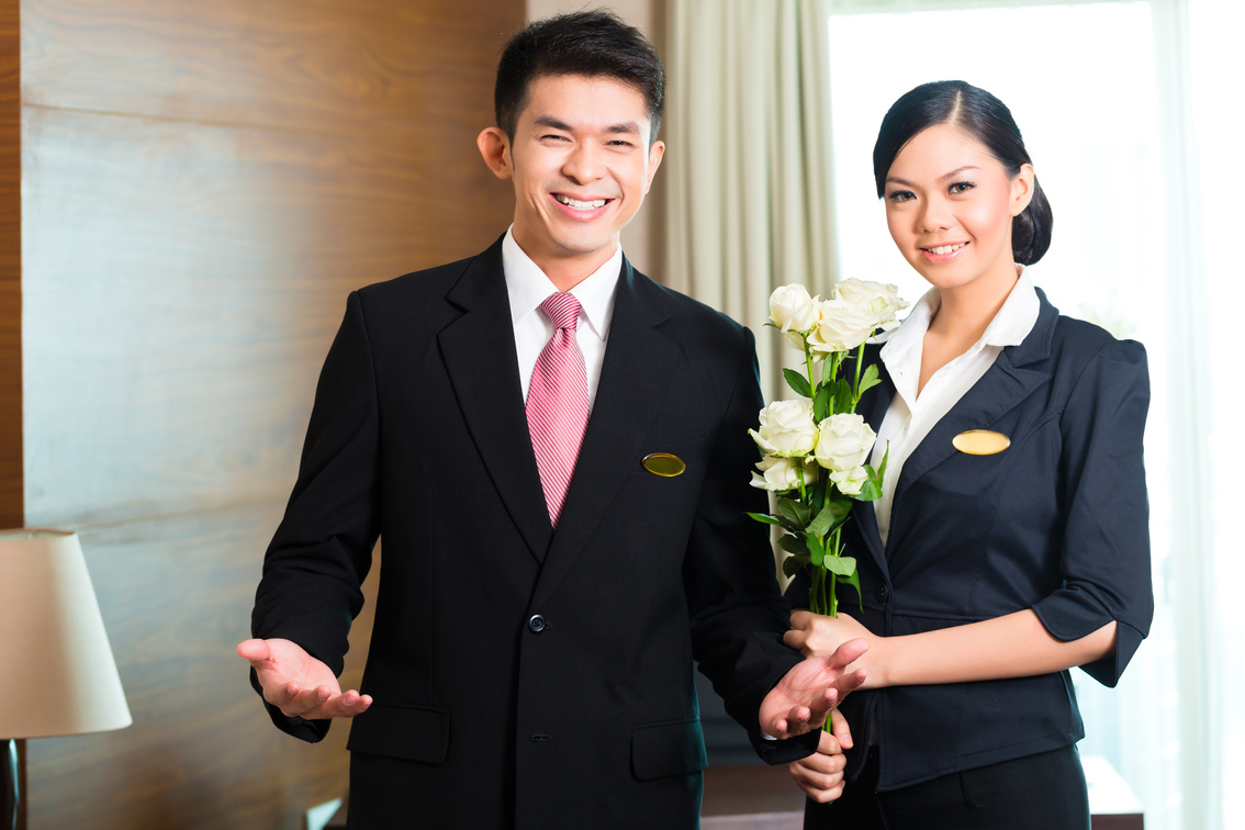Asian Chinese Hotel Manager Welcoming Guests